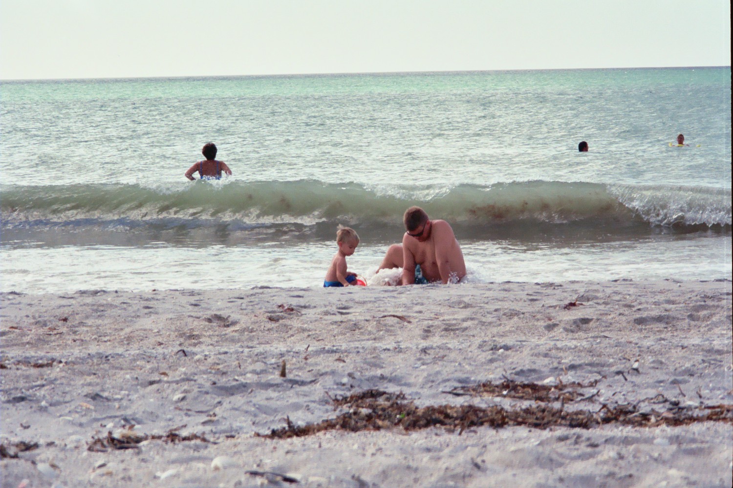 Brandon and Joe digging in the sand