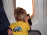 Brandon and his kitty looking out the window on the plane. Bye Florida!