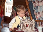 Brandon trying to blow out the candle.