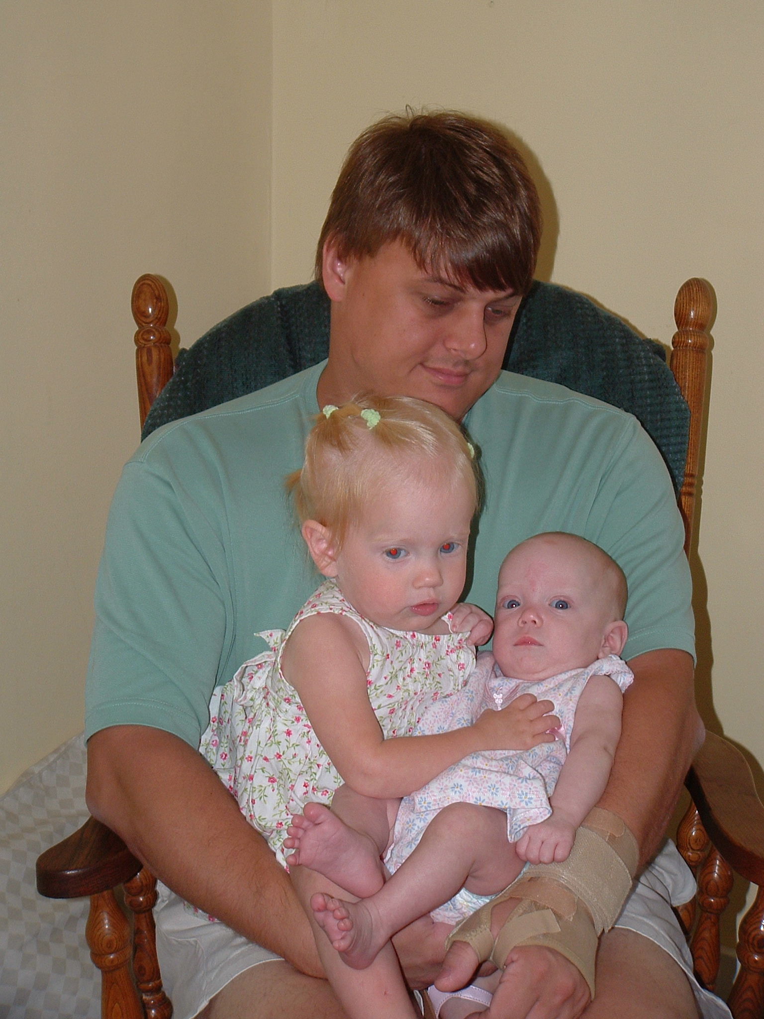 Joe, Ellie and Gracie.  Ellie loves holding her little cousin!