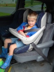 Brandon getting picked up for school....looks too big for a carseat like that!