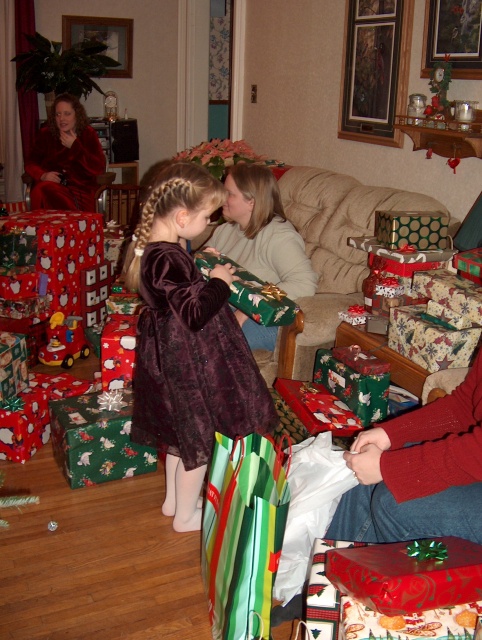 Kayla opening gifts.