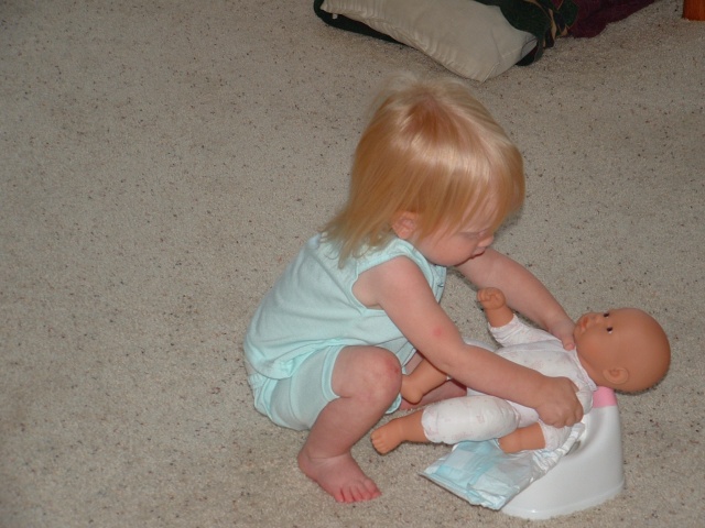 Ellie helping her baby go potty (or as Ellie says...beep!)