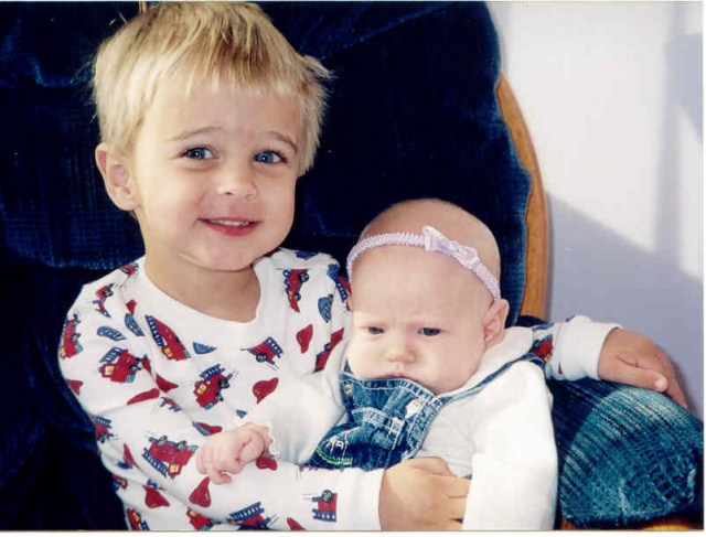 Brandon holding Ellie...he's such a good big brother!