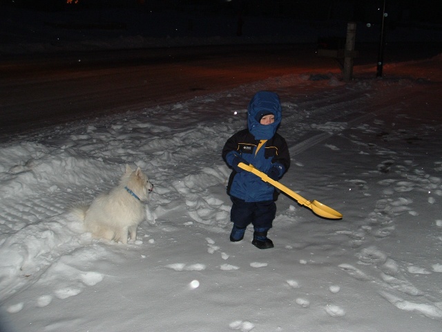 Brandon and Sophie shoveling snow