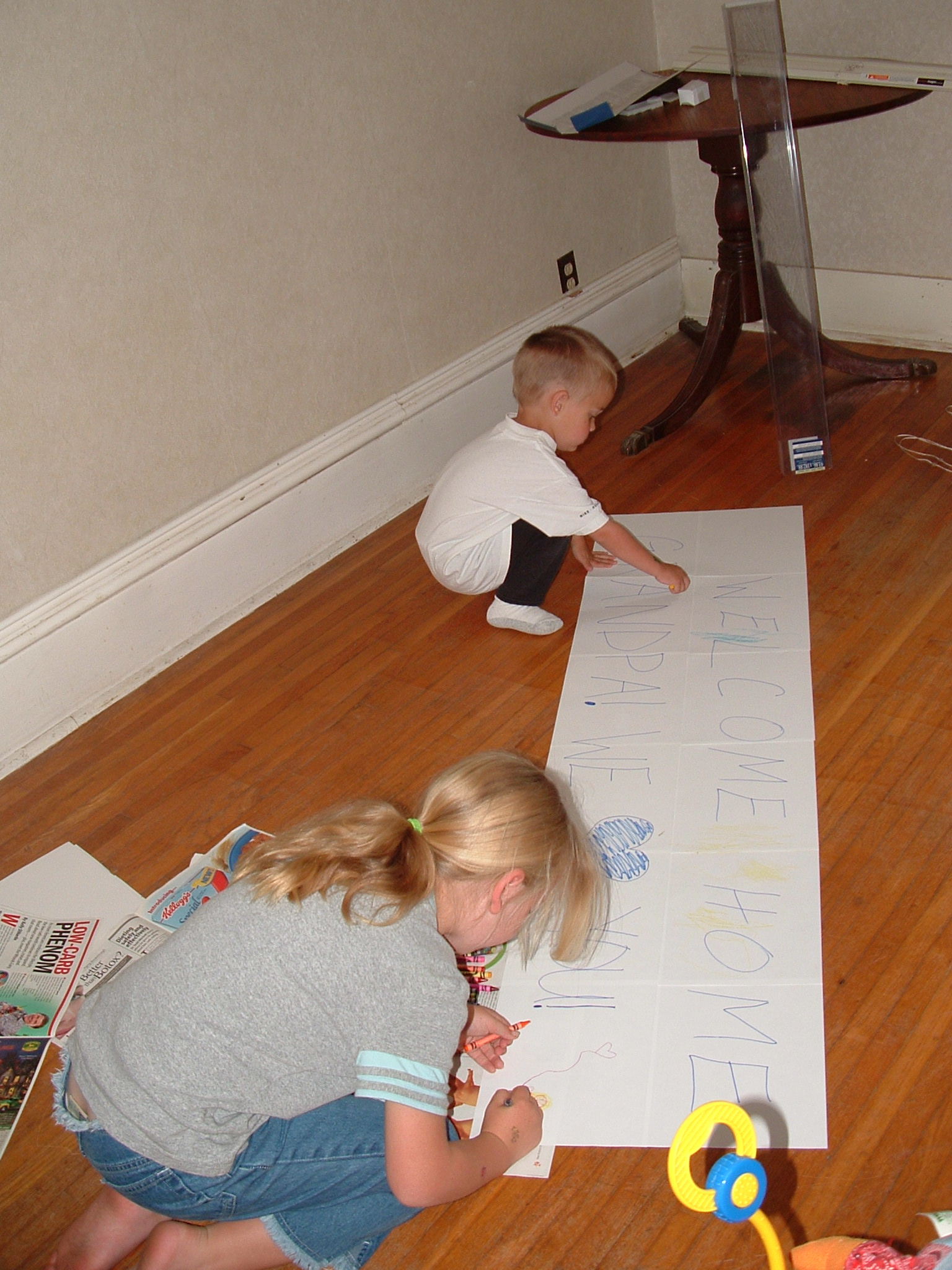 Making a welcome home sign for Grandpa