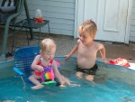 Ellie found a way to sit down in the pool without going under water!